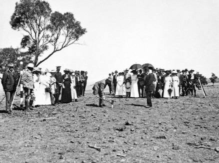 The Minister for Home Affairs, King O'Malley, drives the first peg in the site for Canberra, the national capital, 1913